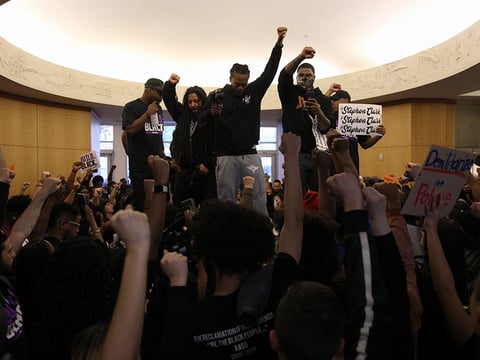 Protesters filled the lobby of Sacramento City Hall during a community forum on the police shooting of Stephon Clark.